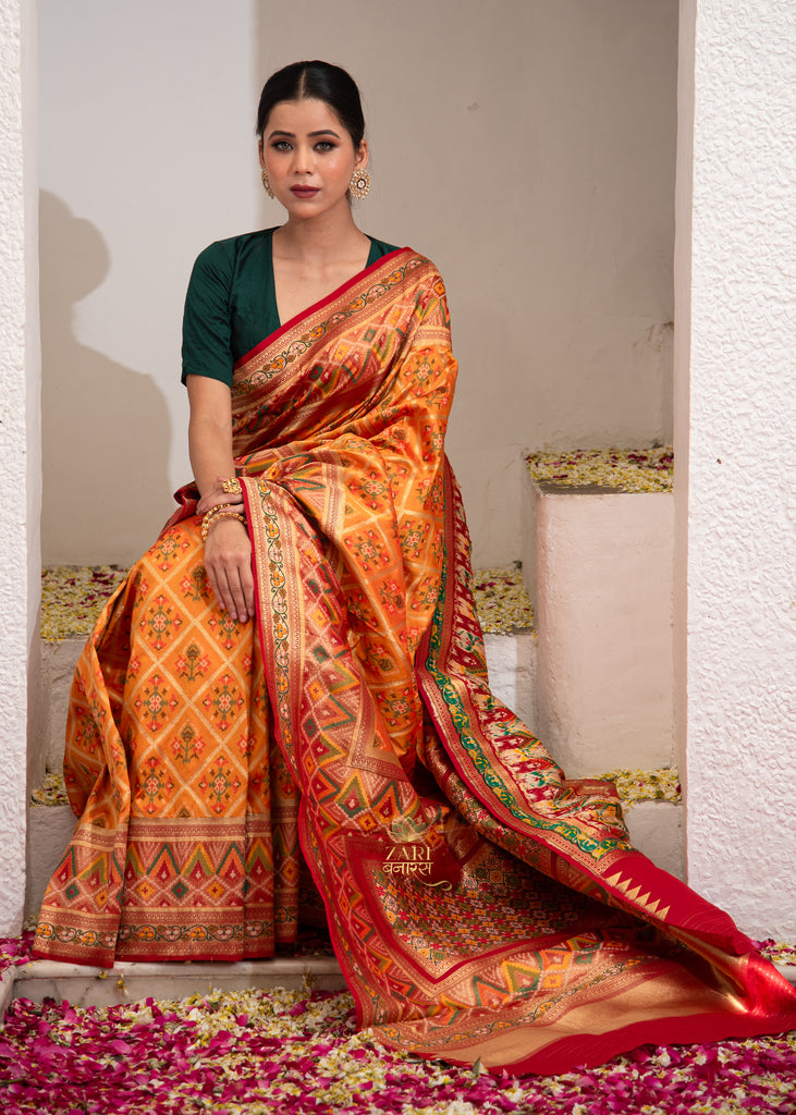 Inaya : Orange Ikat Patan Patola Banarasi Saree with Brocade Border