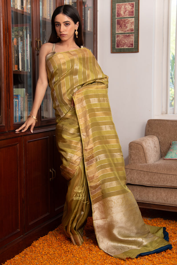 Jaya green Banarasi silk saree with alternating gold and silver zari stripe weave