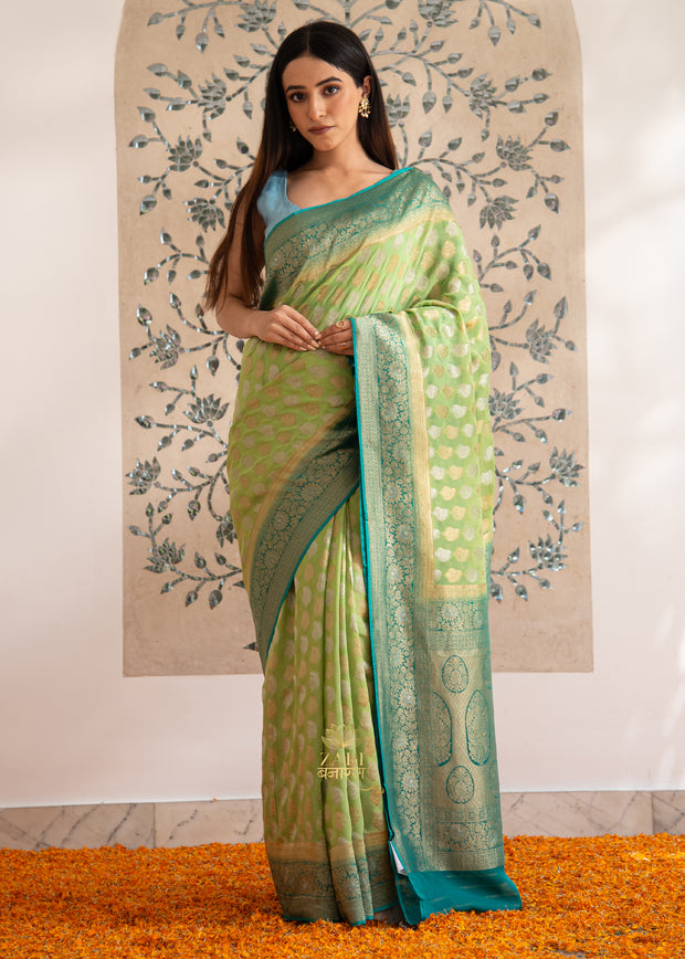 Ira sea green and blue Banarasi Georgette saree with scattered gold zari butis