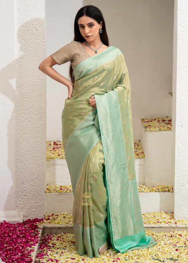Isha sage green Banarasi tissue silk saree with metallic sheen and light drape