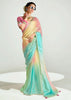 Woman wearing a pastel-colored saree with a gradient effect on a white background