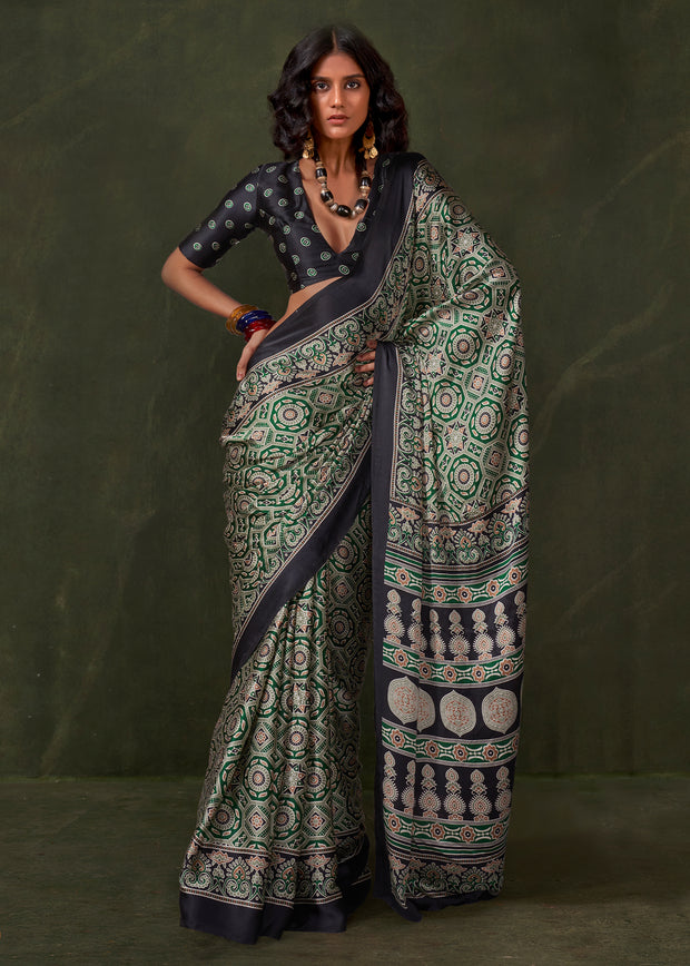 Medium green printed satin crepe silk saree with soft drape