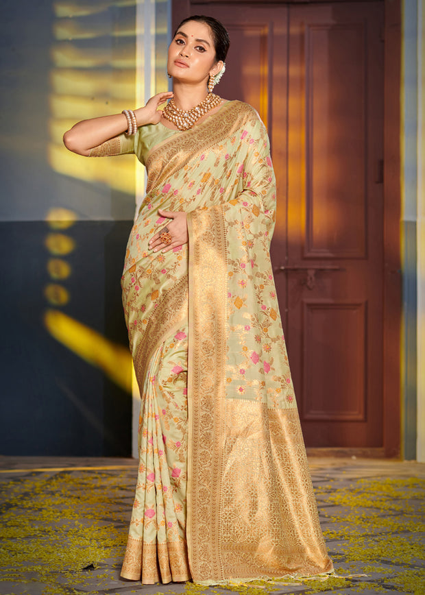 Pale green Banarasi silk saree with woven brocade motifs and contrast blouse