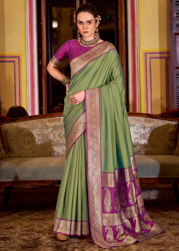 Dusky green Banarasi soft silk saree with handwoven zari motifs from Varanasi