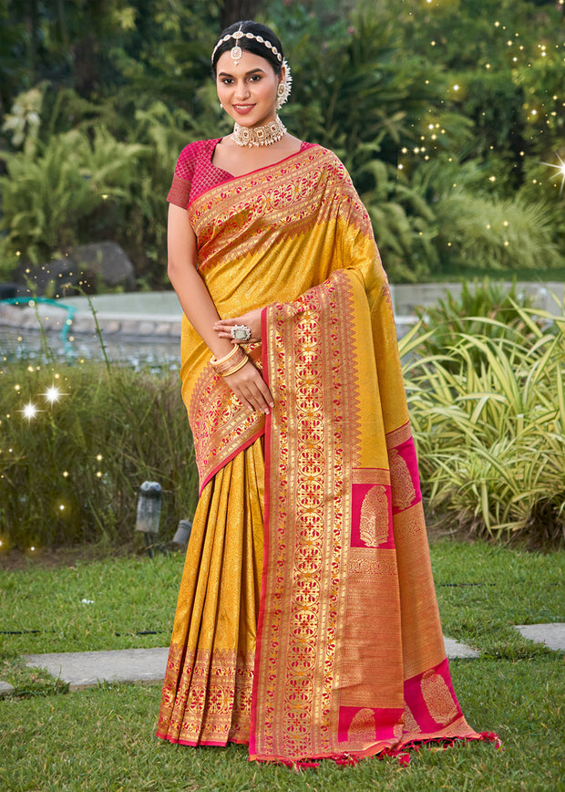 Festive yellow Banarasi silk saree with handwoven zari motifs from Varanasi
