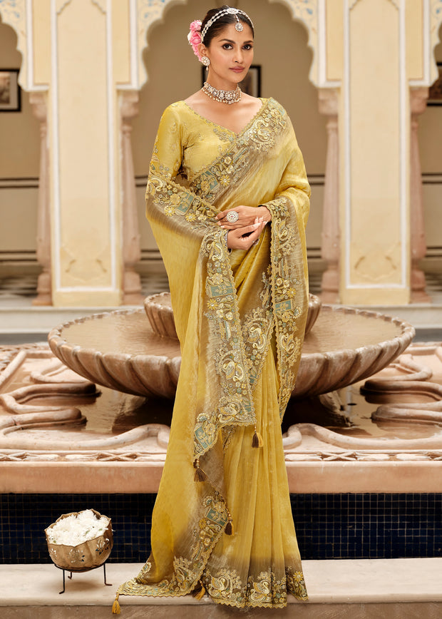 Vivid yellow designer silk saree with intricate hand embroidery and contrast detailing