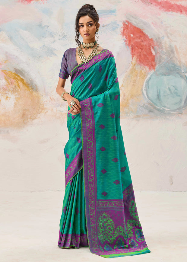Marine green Kanjivaram silk saree with deep colour and traditional Kanchipuram weaving