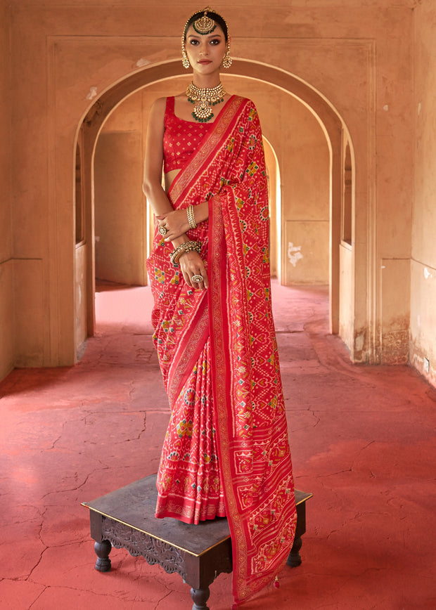 Fiery red Patola silk saree with boldly printed geometric heritage motifs