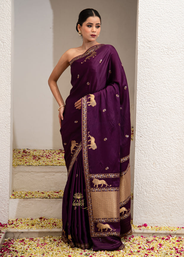 Vantara purple Banarasi satin silk saree with Shikargah hunting motif and zari detail