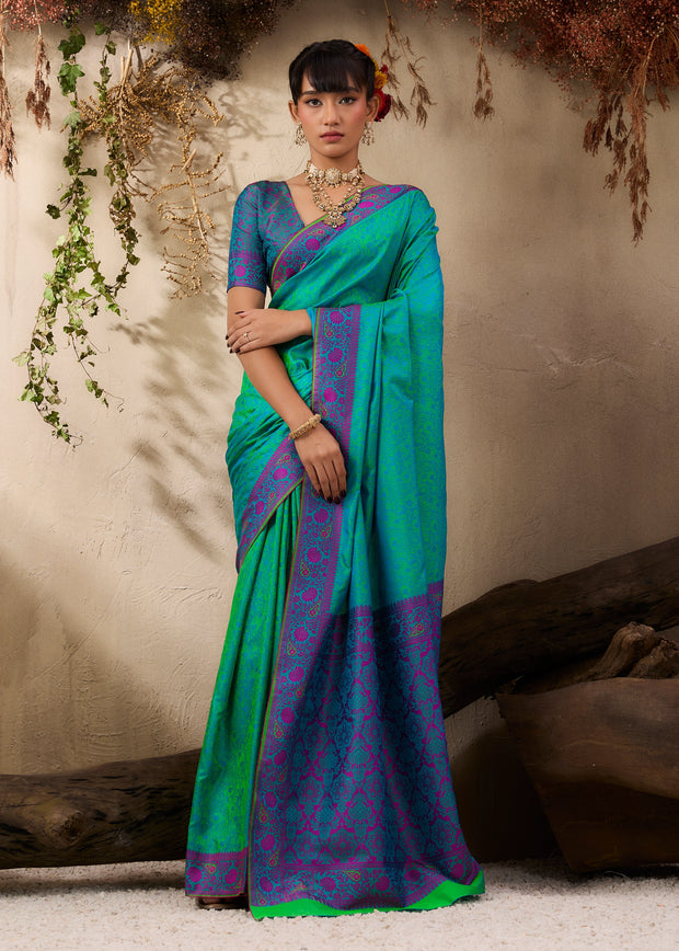 Peacock green Kanjivaram silk saree with traditional Kanchipuram weaving and woven body