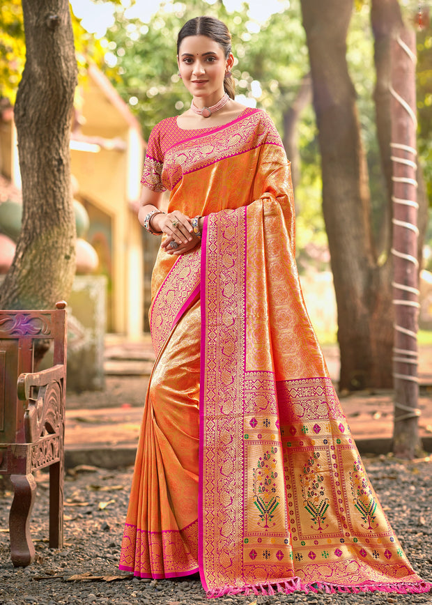 Flame orange Kanjivaram silk saree with traditional gold zari and woven Kanchipuram border
