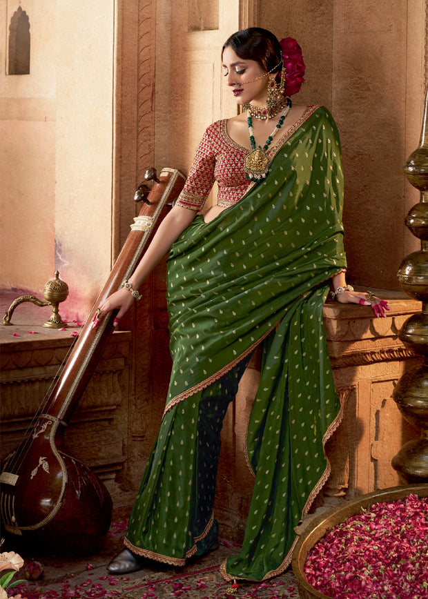 Medium green woven embroidered saree with contrast blouse