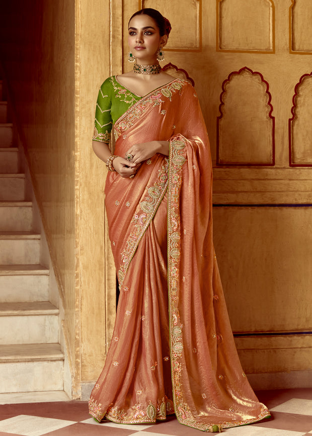 Apricot peach heavy embroidered silk saree with intricate motifs