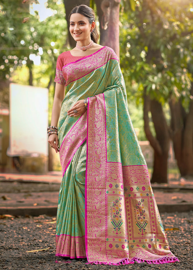 Golden green Kanjivaram silk saree with gold zari work and rich woven Kanchipuram border
