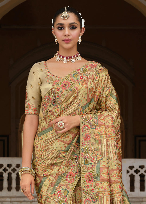 Woman wearing a traditional saree with intricate patterns in an indoor setting.