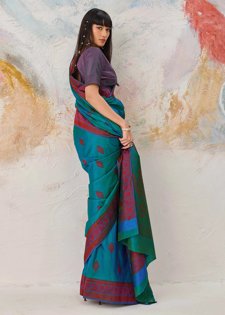 Enamel blue Kanjivaram silk saree with jewel tone and traditional Kanchipuram weaving