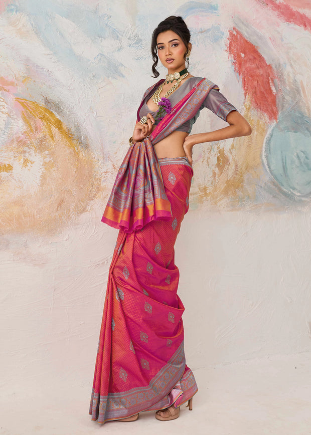 Flamingo pink Kanjivaram silk saree with warm coral tone and Kanchipuram weaving
