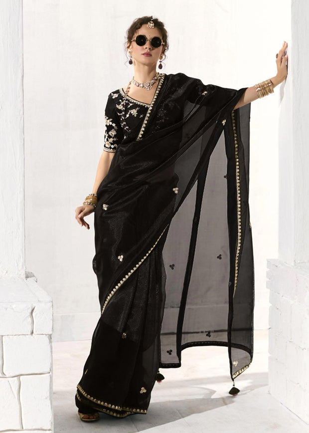 Black designer organza tissue silk saree with sheer drape and embroidered detailing