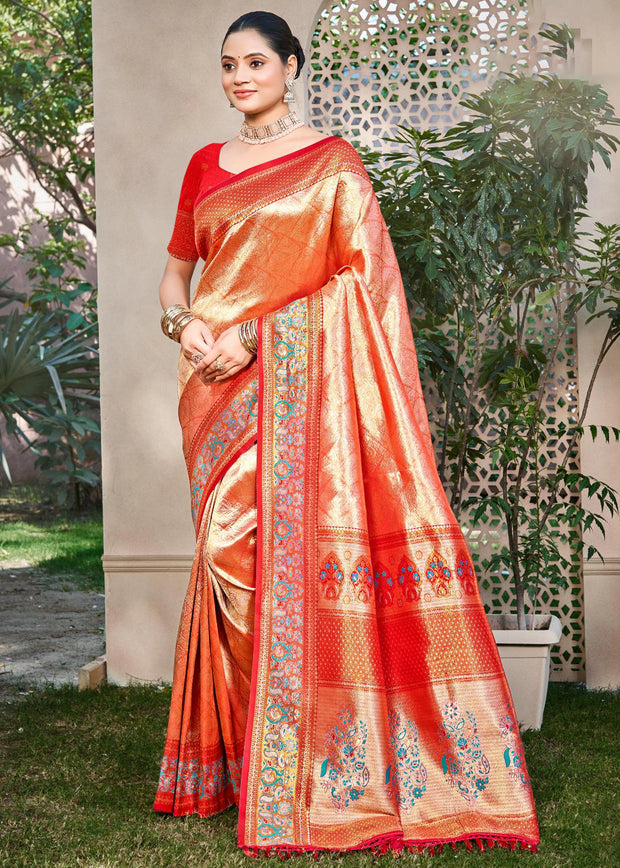 Orange Kanjivaram silk saree with gold zari motifs and Kanchipuram weaving