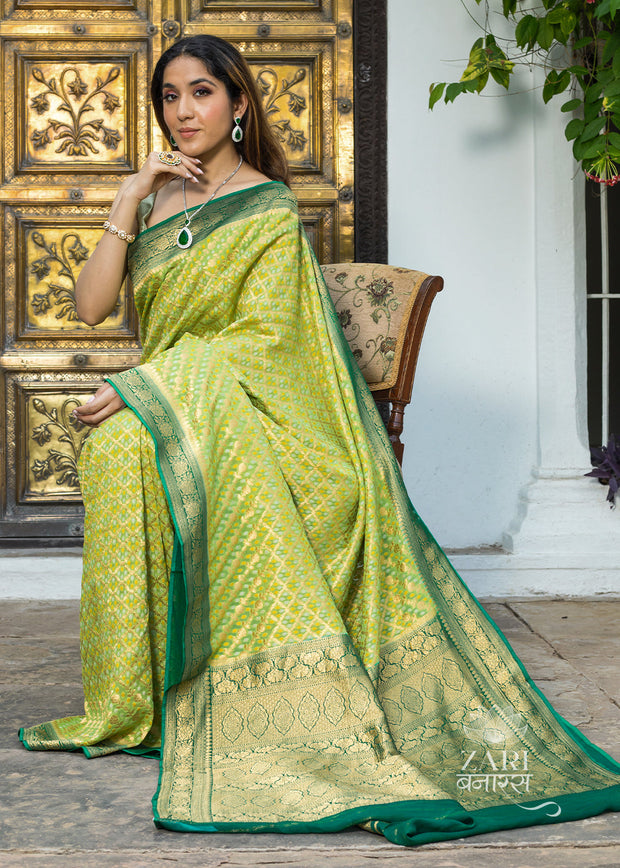 Divya green Khaddi Georgette handloom Banarasi saree with woven zari motifs