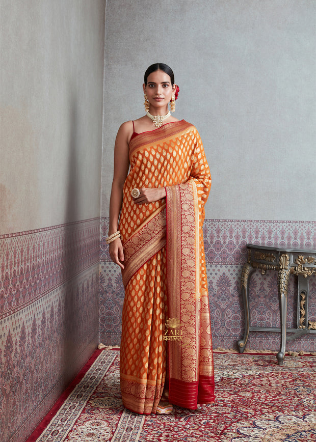 Aarti orange and red Khaddi Georgette handloom Banarasi saree with zari motifs