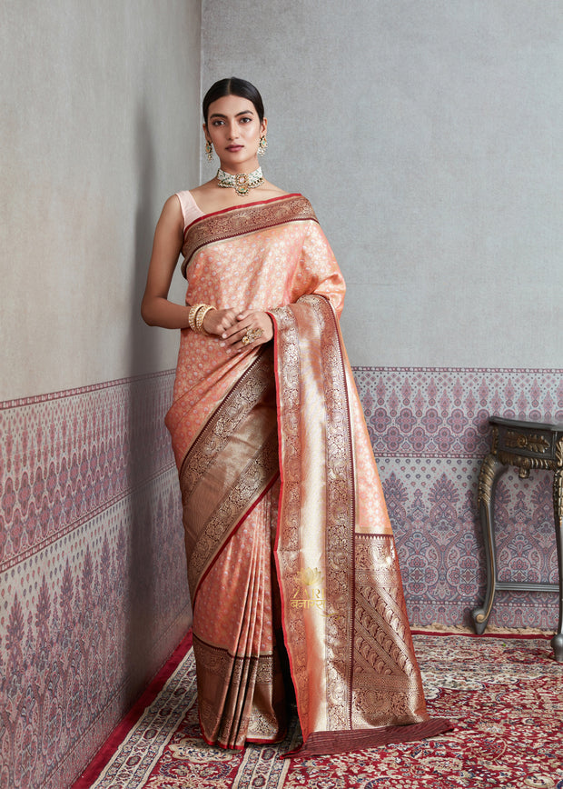 Nakshatra peach Banarasi tissue silk saree with metallic sheen and handwoven body
